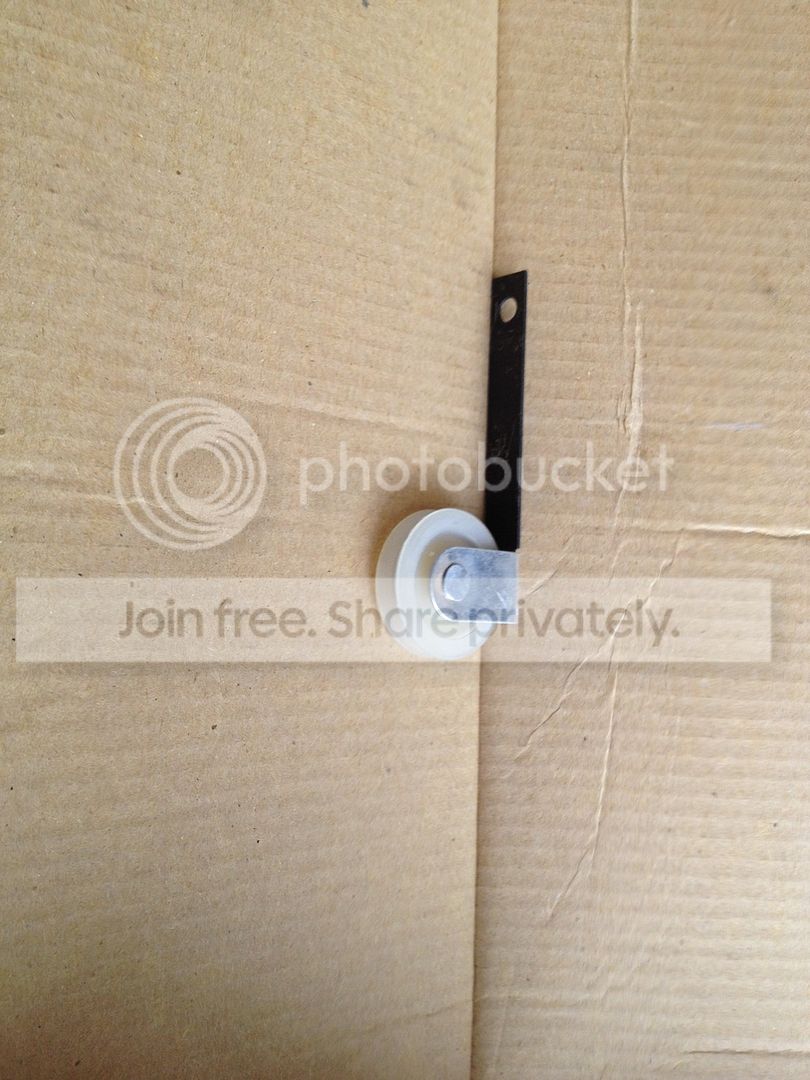 (Not mentioned by Murph's install instructions) My little wheel thiggy was  from Home Depot.. a sliding screen door wheel... ...works the charm.